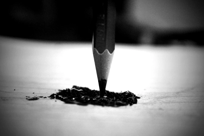 black pencil on white surface